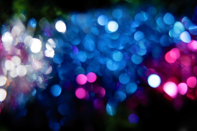 Blurred reflections on black background