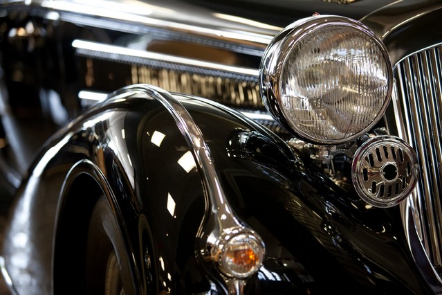 Old black car with headlamp