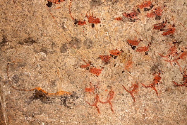 Bushmen (san) rock painting of human figures, antelopes and a predator (leopard), South Africa