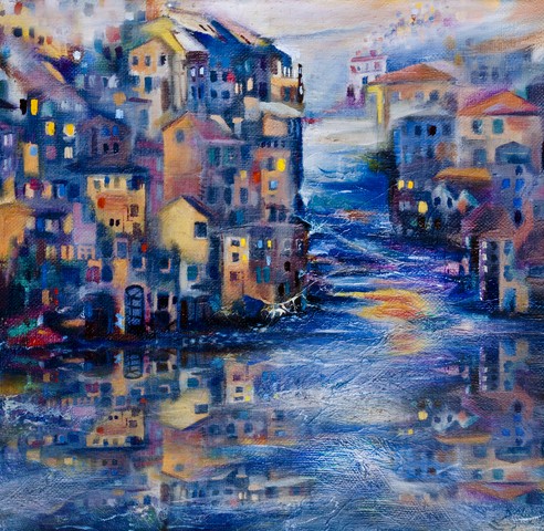 Evening reflection of the city in the sea