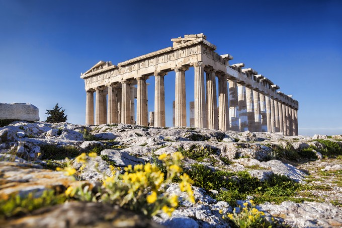 Parthenon temple with spring flowers on the Acropolis in Athens, Greece