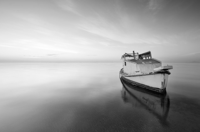 Black and white, little old boat abandoned in the Mar Menor, Spain