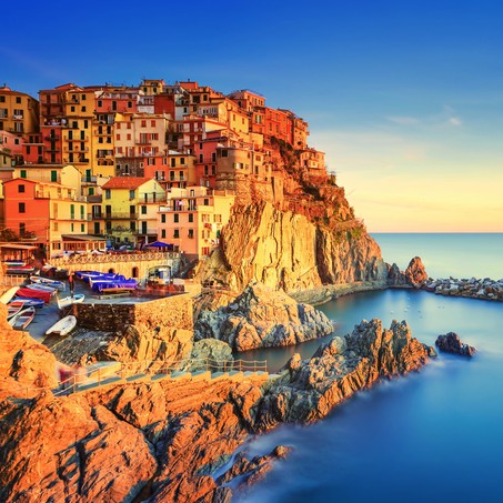 Manarola village on cliff rocks and sea at sunset., Seascape in Five lands, Cinque Terre National Park, Liguria Italy Europe